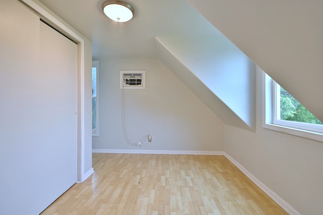 1021 Vine St, Joliet, IL 60435 - bonus room with wood finished floors, baseboards, and a wall mounted AC