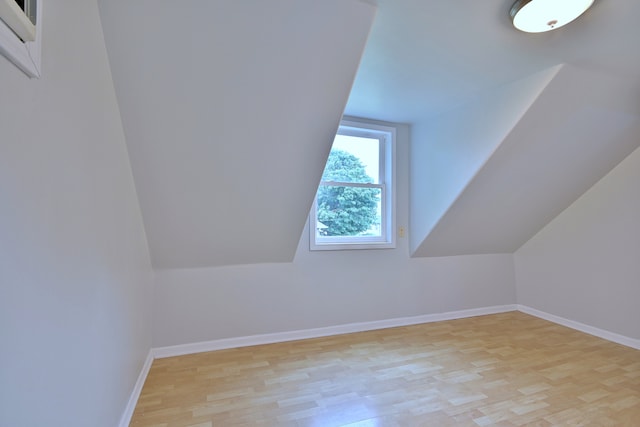 1021 Vine St, Joliet, IL 60435 - bonus room with light wood finished floors, baseboards, and lofted ceiling