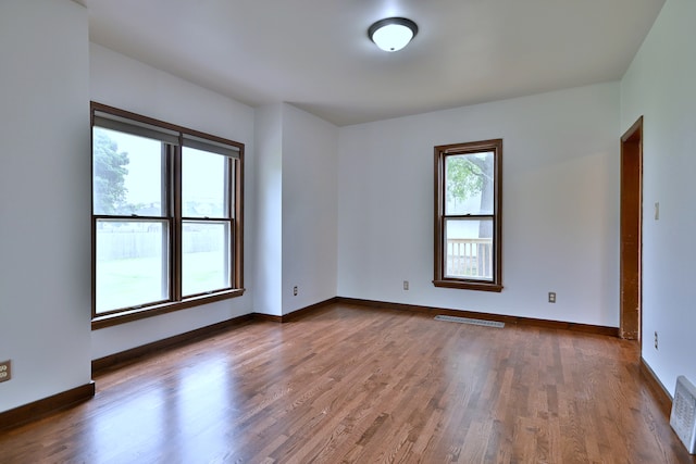 1021 Vine St, Joliet, IL 60435 - spare room featuring wood finished floors and baseboards