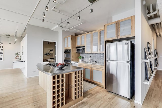 1530 S State St Unit 17B, Chicago, IL 60605 - kitchen with appliances with stainless steel finishes, light wood finished floors, stainless steel counters, and a center island