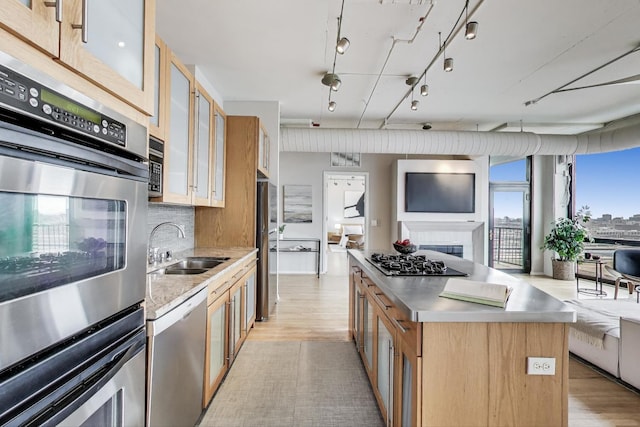 1530 S State St Unit 17B, Chicago, IL 60605 - kitchen with stainless steel counters, appliances with stainless steel finishes, light wood-style flooring, and open floor plan
