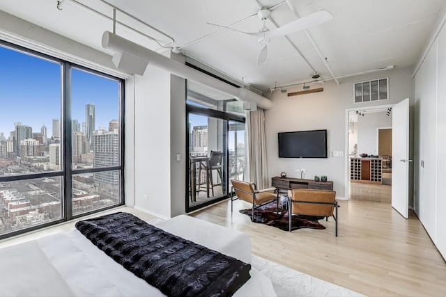 1530 S State St Unit 17B, Chicago, IL 60605 - bedroom with wood finished floors, access to outside, multiple windows, and a skyline view