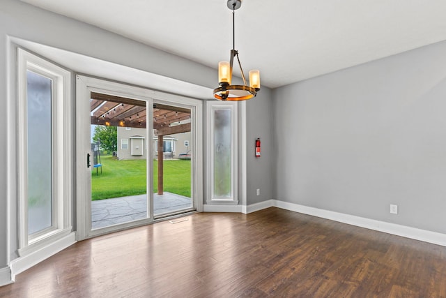 1924 Prestwold Pl, Machesney Park, IL 61115 - spare room with a chandelier, dark wood-style flooring, and baseboards