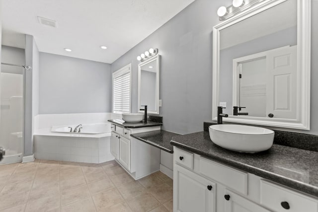 1924 Prestwold Pl, Machesney Park, IL 61115 - bathroom with vanity, a garden tub, a shower stall, tile patterned flooring, and recessed lighting