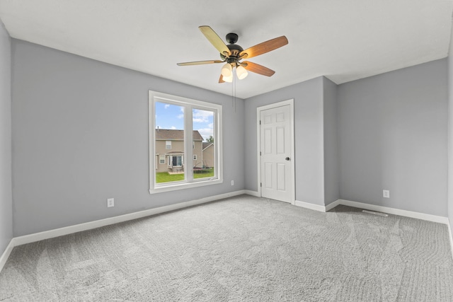 1924 Prestwold Pl, Machesney Park, IL 61115 - unfurnished bedroom with baseboards, carpet floors, and a ceiling fan