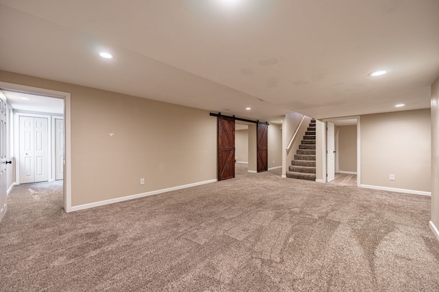 1924 Prestwold Pl, Machesney Park, IL 61115 - finished basement with a barn door, stairway, carpet floors, recessed lighting, and baseboards