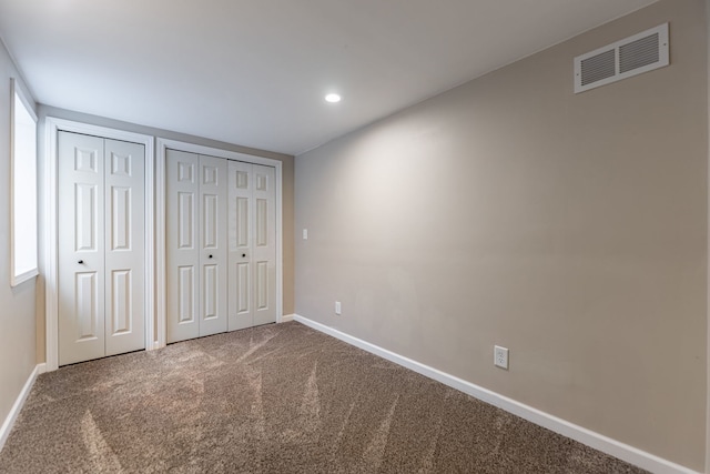1924 Prestwold Pl, Machesney Park, IL 61115 - unfurnished bedroom with two closets, carpet flooring, baseboards, and recessed lighting
