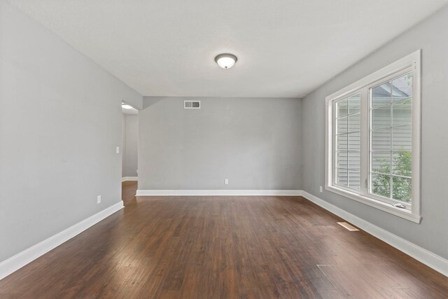 1924 Prestwold Pl, Machesney Park, IL 61115 - unfurnished room with dark wood-type flooring, healthy amount of natural light, and baseboards