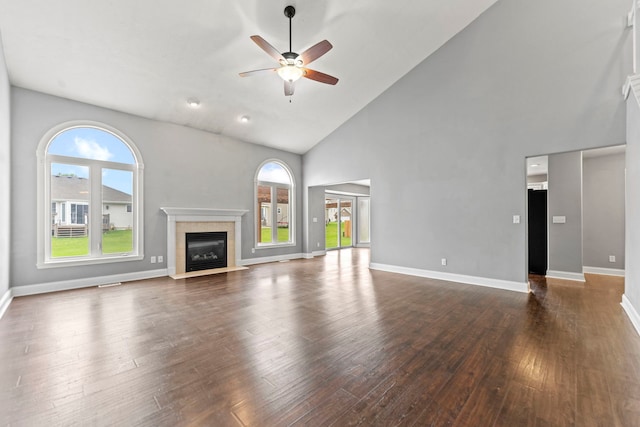 1924 Prestwold Pl, Machesney Park, IL 61115 - unfurnished living room with ceiling fan, healthy amount of natural light, high vaulted ceiling, a tiled fireplace, and baseboards