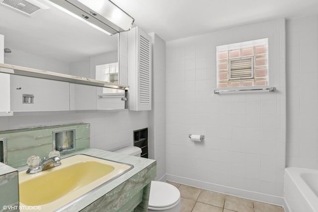 5200 S Mozart Ave, Chicago, IL 60632 - full bathroom with toilet, vanity, a bathtub, tile patterned floors, and tile walls
