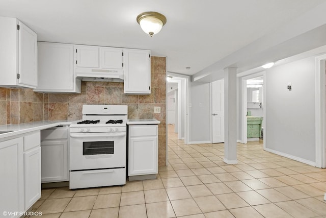 5200 S Mozart Ave, Chicago, IL 60632 - kitchen featuring white range with gas stovetop, light countertops, under cabinet range hood, and white cabinets