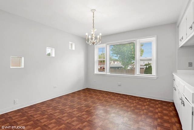 5200 S Mozart Ave, Chicago, IL 60632 - unfurnished dining area featuring a chandelier and baseboards