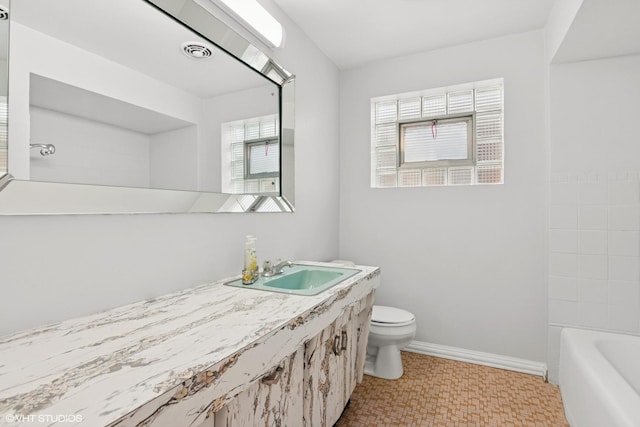 5200 S Mozart Ave, Chicago, IL 60632 - bathroom featuring toilet, vanity, tile patterned floors, and baseboards