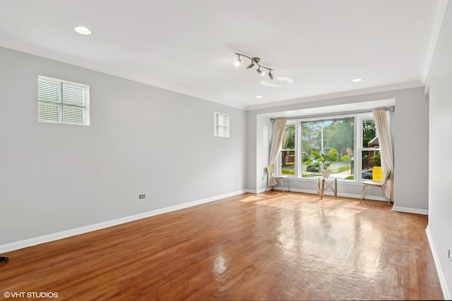 5200 S Mozart Ave, Chicago, IL 60632 - spare room featuring ornamental molding, baseboards, wood finished floors, and recessed lighting