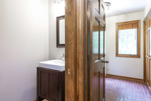 841 Turnbridge Cir, Naperville, IL 60540 - bathroom featuring brick flooring, vanity, and baseboards