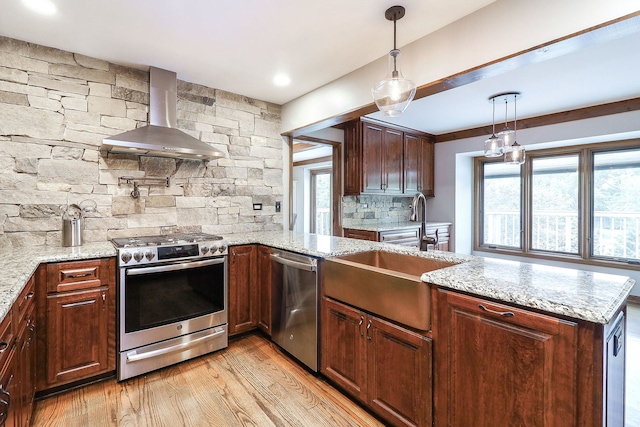 841 Turnbridge Cir, Naperville, IL 60540 - kitchen with stainless steel appliances, wall chimney range hood, a sink, light wood-type flooring, and tasteful backsplash