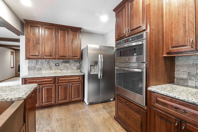 841 Turnbridge Cir, Naperville, IL 60540 - kitchen featuring stainless steel appliances, tasteful backsplash, light wood-style floors, light stone countertops, and recessed lighting