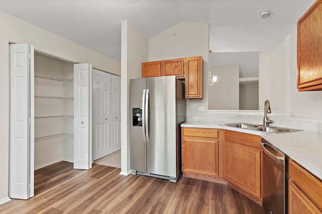 1623 Camberley Ct, Bartlett, IL 60103 - kitchen featuring stainless steel appliances, a sink, dark wood-style floors, light countertops, and vaulted ceiling