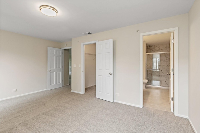1623 Camberley Ct, Bartlett, IL 60103 - unfurnished bedroom featuring carpet, baseboards, and a walk in closet