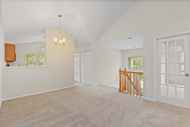 1623 Camberley Ct, Bartlett, IL 60103 - carpeted empty room with a chandelier, lofted ceiling, and baseboards