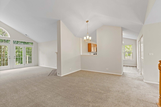 1623 Camberley Ct, Bartlett, IL 60103 - carpeted empty room featuring lofted ceiling, a chandelier, and baseboards