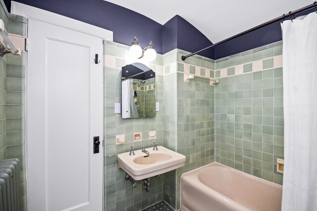 2906 Lincoln St, Evanston, IL 60201 - full bathroom with radiator heating unit, tile walls, shower / bathtub combination with curtain, and a sink