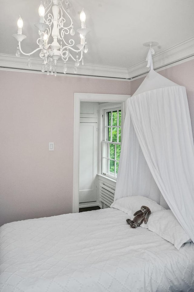 2906 Lincoln St, Evanston, IL 60201 - bedroom featuring crown molding and a chandelier
