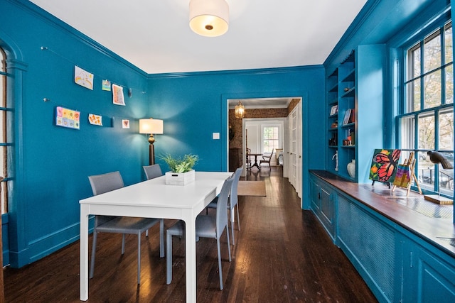 2906 Lincoln St, Evanston, IL 60201 - dining room featuring dark wood-style floors, built in features, ornamental molding, and baseboards