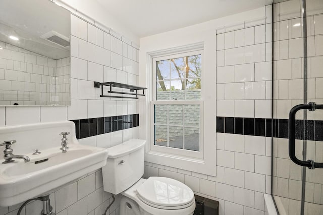 2906 Lincoln St, Evanston, IL 60201 - bathroom with tile walls, toilet, and a sink