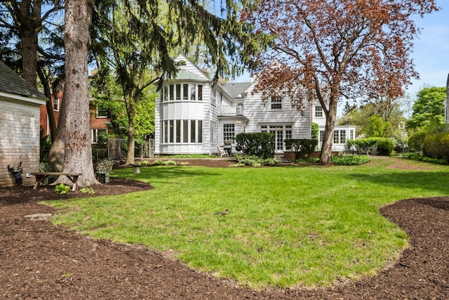 2906 Lincoln St, Evanston, IL 60201 - rear view of house featuring a lawn and board and batten siding