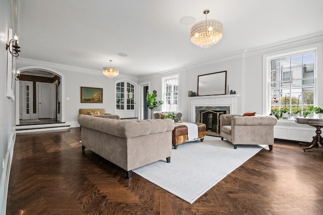 2906 Lincoln St, Evanston, IL 60201 - living area featuring ornamental molding, a high end fireplace, arched walkways, and a chandelier