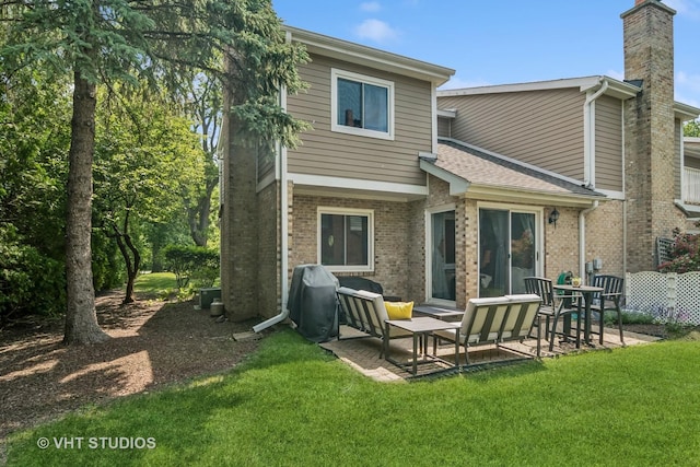 230 W Golfview Ter, Palatine, IL 60067 - back of house with brick siding, a lawn, a patio area, and a chimney