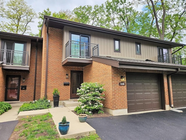1830 Chestnut Ave Unit 1830, Glenview, IL 60025 - view of property featuring a balcony, an attached garage, and brick siding