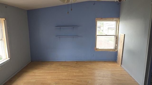 316 E 107th St, Chicago, IL 60628 - empty room featuring light wood-style flooring, plenty of natural light, and ceiling fan