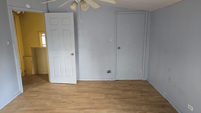 316 E 107th St, Chicago, IL 60628 - unfurnished bedroom with light wood-type flooring, vaulted ceiling, and a ceiling fan
