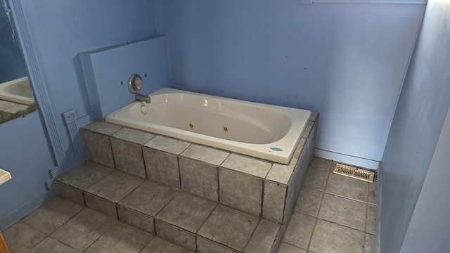 316 E 107th St, Chicago, IL 60628 - full bath featuring a tub with jets, tile patterned flooring, and baseboards