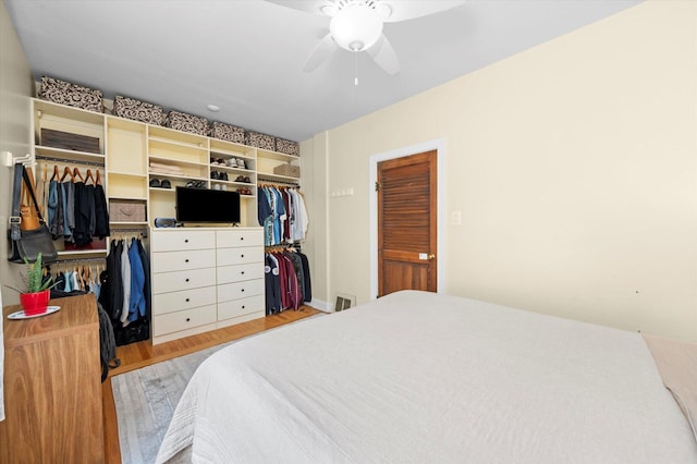 6141 W Peterson Ave, Chicago, IL 60646 - bedroom featuring a ceiling fan, light wood-type flooring, and multiple closets