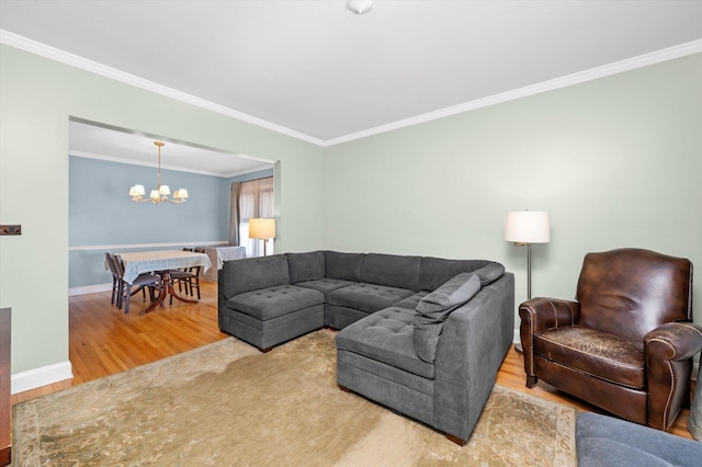 6141 W Peterson Ave, Chicago, IL 60646 - living area featuring wood finished floors, a chandelier, crown molding, and baseboards