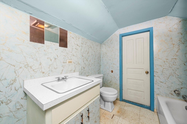 6141 W Peterson Ave, Chicago, IL 60646 - bathroom featuring lofted ceiling, vanity, toilet, and a bathtub
