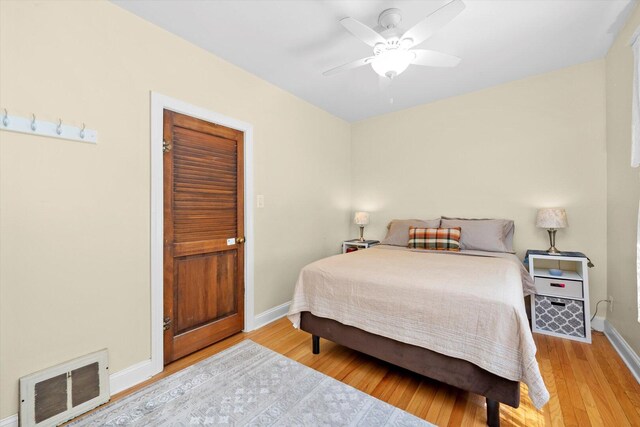 6141 W Peterson Ave, Chicago, IL 60646 - bedroom with baseboards, light wood-type flooring, and a ceiling fan