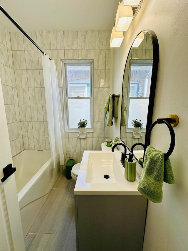 8344 S Ada St, Chicago, IL 60620 - full bathroom featuring vanity, shower / tub combo, toilet, and tile walls