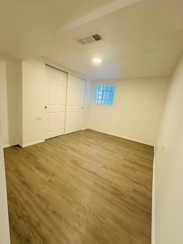 8344 S Ada St, Chicago, IL 60620 - unfurnished bedroom with wood finished floors, baseboards, and a closet