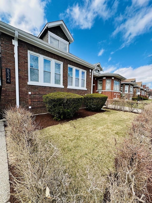 8344 S Ada St, Chicago, IL 60620 - view of front of home with brick siding and a front lawn