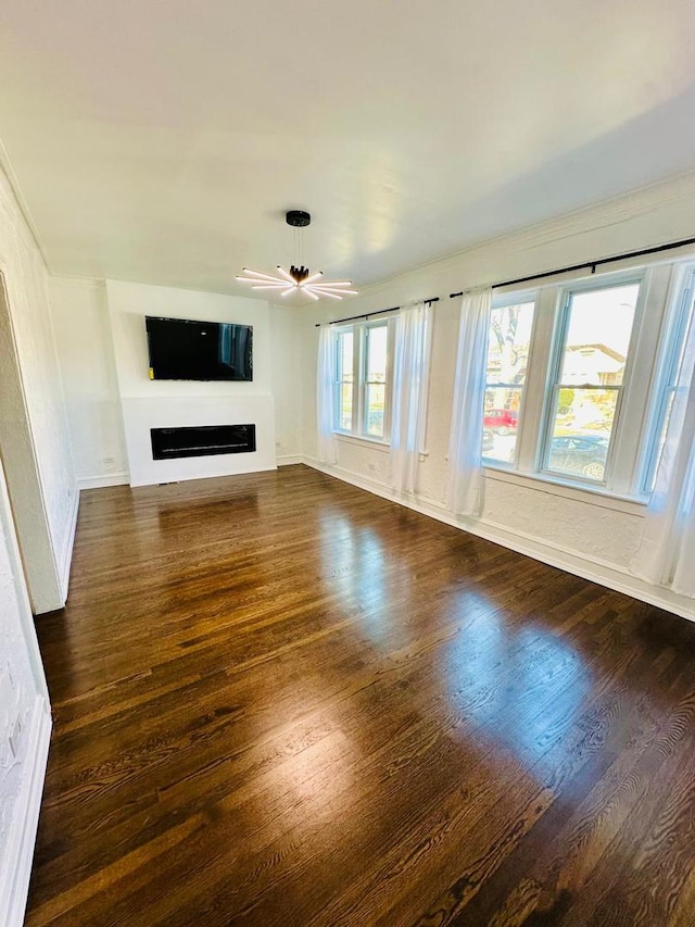 8344 S Ada St, Chicago, IL 60620 - unfurnished living room with dark wood finished floors, a fireplace, a ceiling fan, baseboards, and crown molding