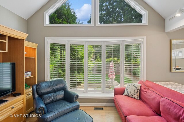 6209 N Legett Ave, Chicago, IL 60646 - living room featuring high vaulted ceiling and wood finished floors