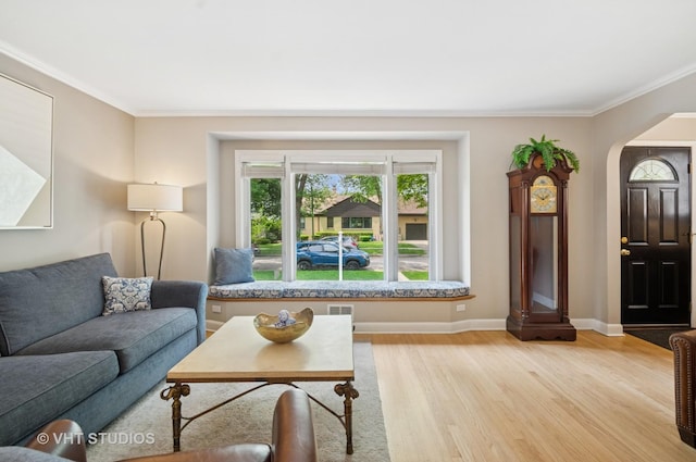 6209 N Legett Ave, Chicago, IL 60646 - living area with light wood-style floors, crown molding, and arched walkways