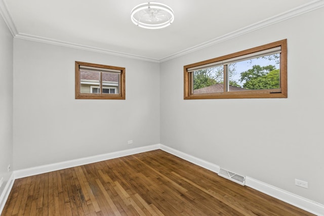 521 N 3rd Ave, Villa Park, IL 60181 - unfurnished room featuring baseboards, dark wood-style floors, and ornamental molding