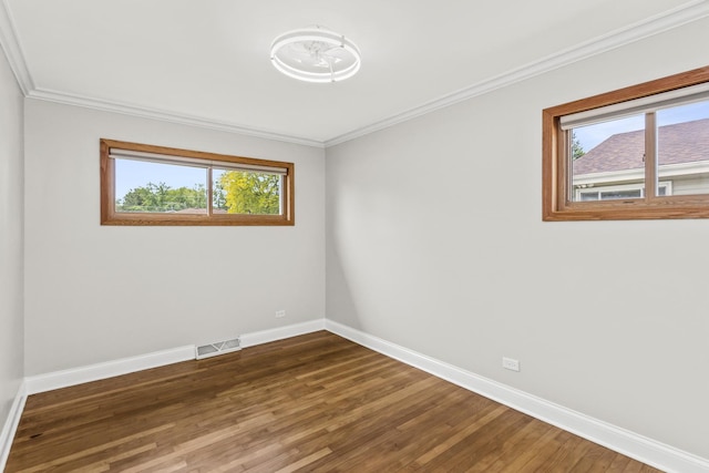 521 N 3rd Ave, Villa Park, IL 60181 - unfurnished room featuring baseboards, plenty of natural light, wood finished floors, and ornamental molding