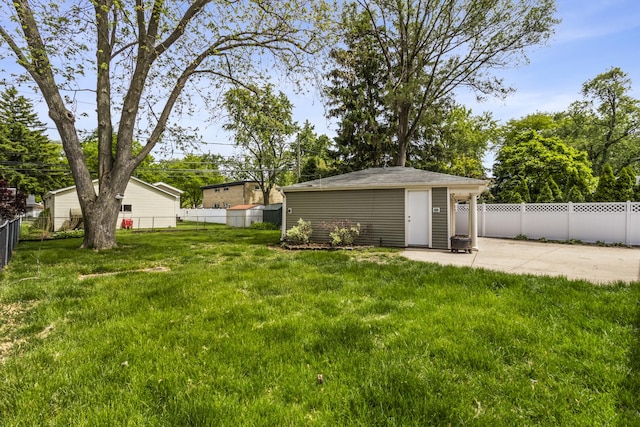 521 N 3rd Ave, Villa Park, IL 60181 - view of yard featuring a patio area, an outdoor structure, and driveway