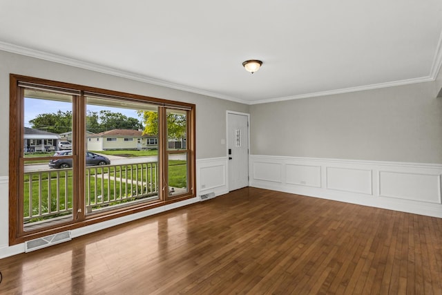 521 N 3rd Ave, Villa Park, IL 60181 - spare room with wood finished floors, ornamental molding, and wainscoting
